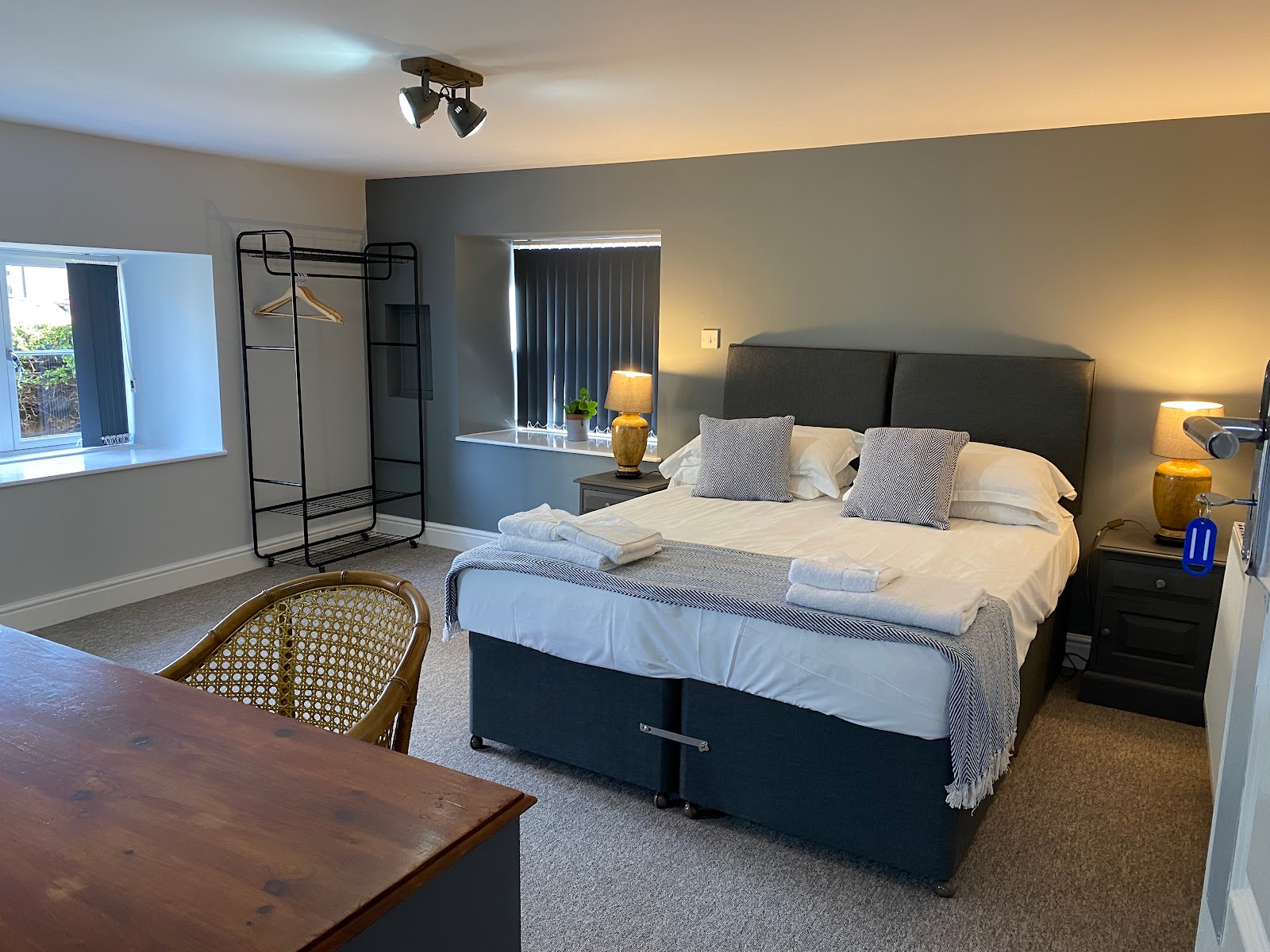 Stylish guest bedroom with a double bed and modern furnishings at The Roade House in Roade.